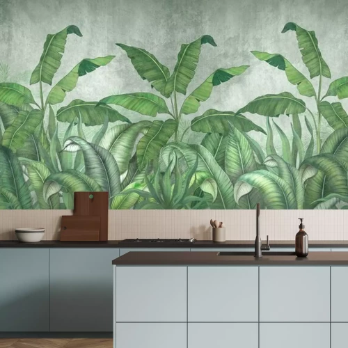 Fotobehang Grote tropische bananenbladeren op een grijze achtergrond