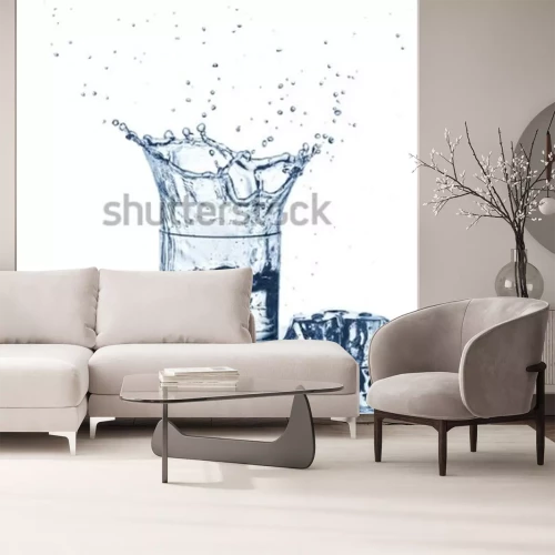 Fotobehang Water splash in glass of blue color