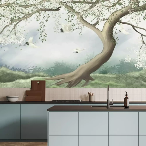 Fotobehang Een bloeiende kersenboom in een weide met vogels