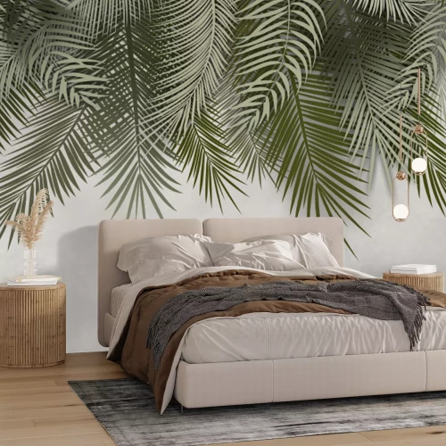 Fotobehang Groene tropische palmbladeren op een grijze achtergrond