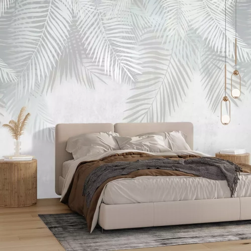 Fotobehang Witte en grijze tropische bladeren op een betonnen achtergrond