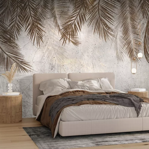 Fotobehang Grote tropische palmbladeren op een betonnen achtergrond