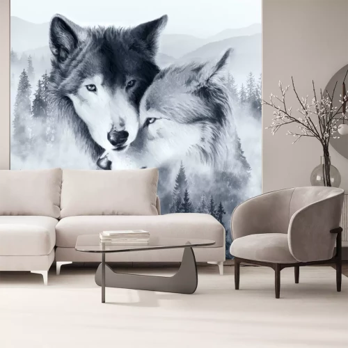 Fotobehang Een paar wolven tegen een mistig landschap met bos