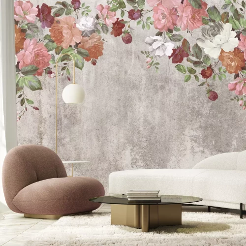 Fotobehang Kleurrijke bloemen hangen van bovenaf tegen een betonnen achtergrond