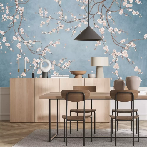 Fotobehang Bloeiende boomtakken op een blauwe achtergrond