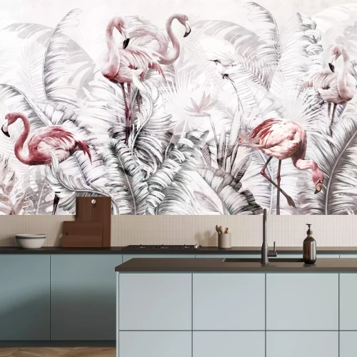 Fotobehang Roze flamingo&#39;s tussen grote tropische bladeren