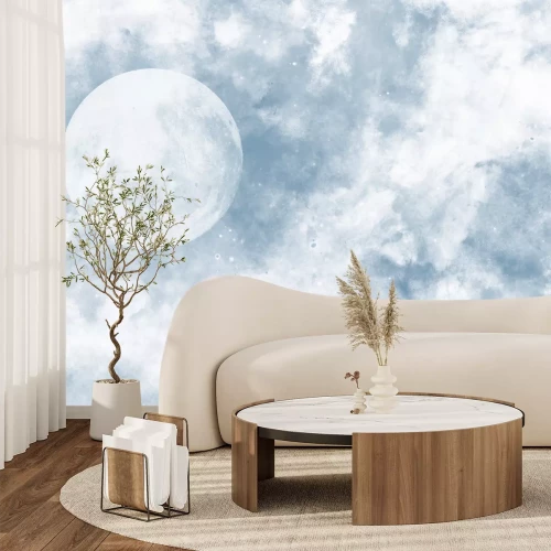 Fotobehang De maan tussen de wolken op een blauwe achtergrond