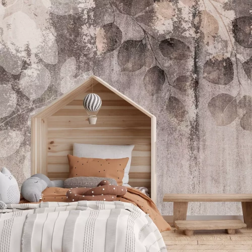 Fotobehang Eucalyptus takken op een betonnen achtergrond