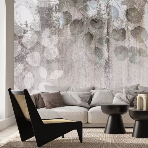 Fotobehang Eucalyptus takken met bladeren op een betonnen achtergrond