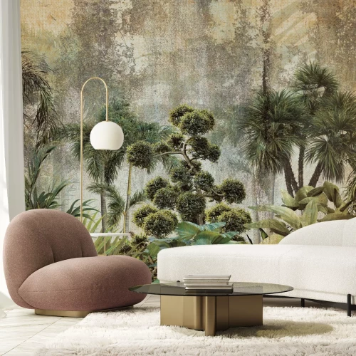 Fotobehang Exotische vegetatie op een betonnen achtergrond, groene compositie