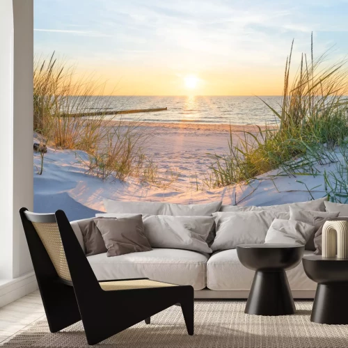 Fotobehang Zandduinen op het strand met uitzicht op de zee en de zonsondergang