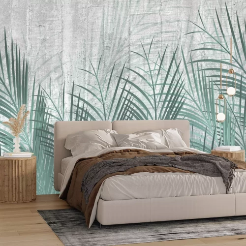 Fotobehang Groene palmbladeren op een grijze betonnen achtergrond