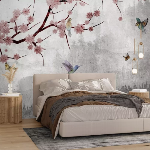 Fotobehang Roze bloemen en vogels tegen een grijs landschap