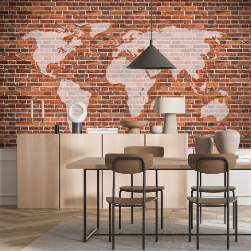 Fotobehang Een wereldkaart op een rode bakstenen achtergrond