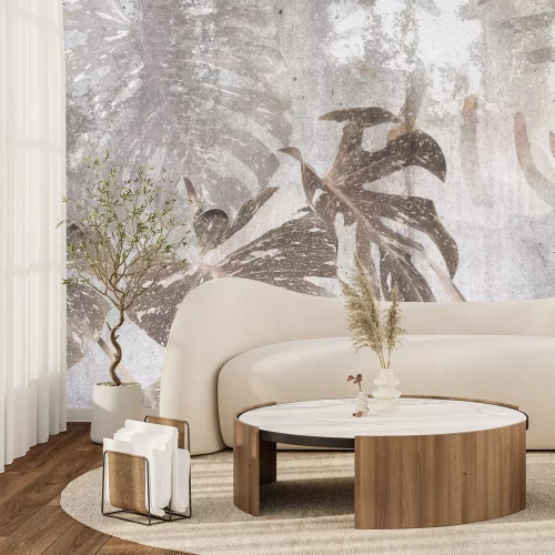 Fotobehang Monsterabladeren op een lichtgrijze betonnen achtergrond