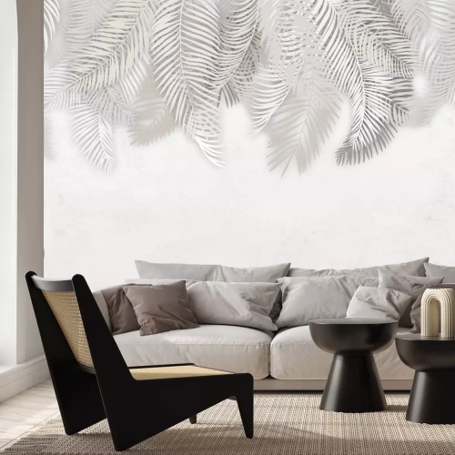 Fotobehang Een delicaat arrangement met witte palmbladeren die erboven hangen