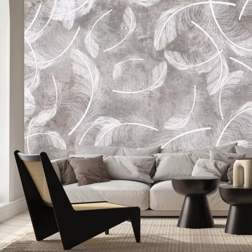 Fotobehang Witte veren op een grijze betonnen achtergrond