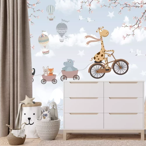 Fotobehang Bergachtig landschap met een giraffe op een fiets