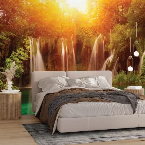 Fotobehang Zonsondergang boven een waterval met turquoise water