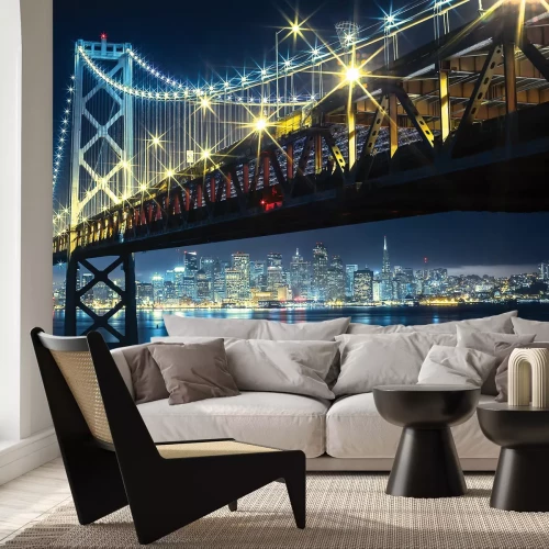 Fotobehang Nachtelijk landschapsbeeld van de brug en verlichte gebouwen