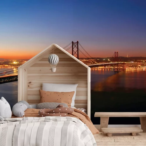 Fotobehang Landschap met een brug bij zonsondergang