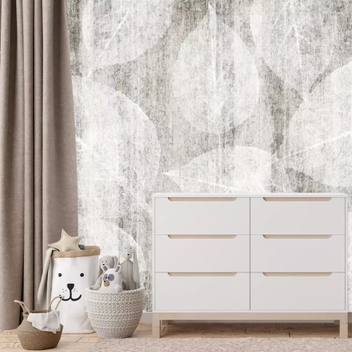 Fotobehang Subtiele bladeren op een kartonnen achtergrond in grijstinten