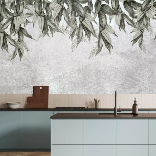 Fotobehang Bladeren hangen van bovenaf tegen een betonnen achtergrond