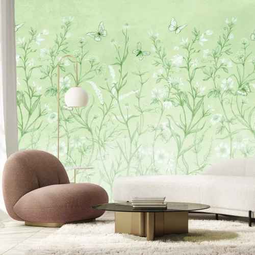 Fotobehang Een groene open plek vol bloemen en dansende vlinders