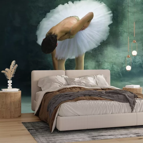 Fotobehang Een ballerina in een lichte rok tegen een betonnen achtergrond