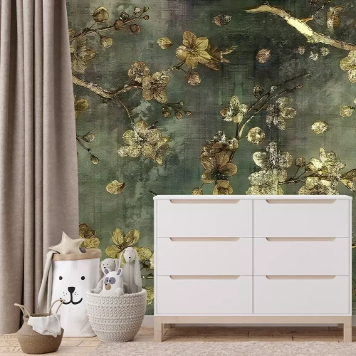 Fotobehang Gouden bloemen tegen een achtergrond van ruw grijs beton