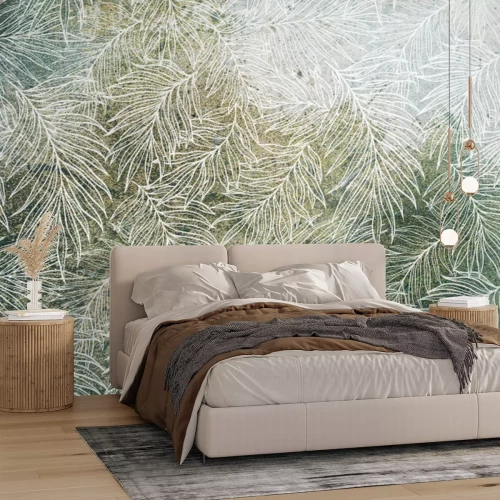 Fotobehang Een delicate witte omtrek van bladeren op een groene achtergrond