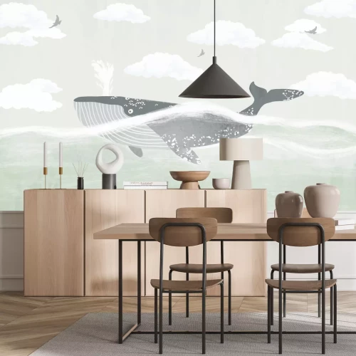 Fotobehang Een walvis in de zee met wolken en vogels op de achtergrond