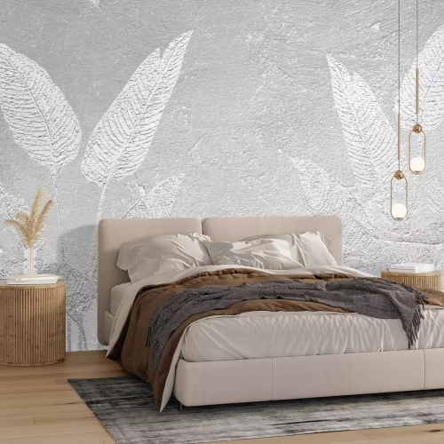 Fotobehang Imitatiebladeren op grijs beton