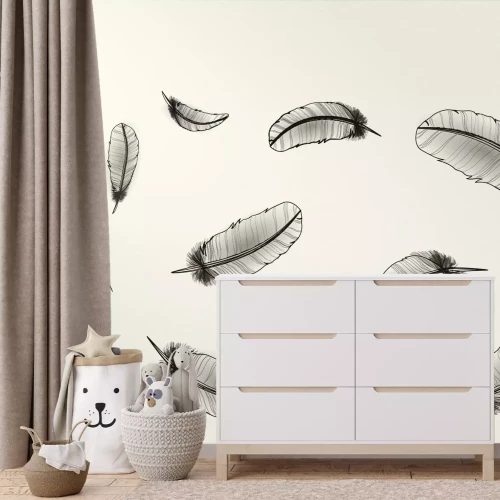 Fotobehang Zwarte veren op een lichte achtergrond