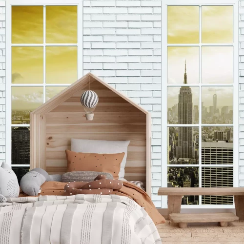 Fotobehang Het Empire State Building gezien door ramen in een bakstenen muur