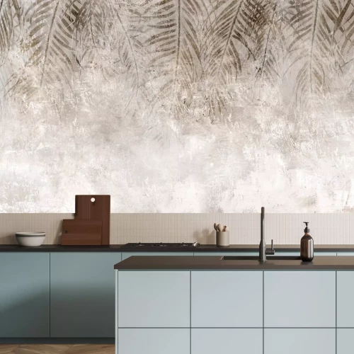 Fotobehang Bruine palmbladeren tegen een betonnen achtergrond in loftstijl