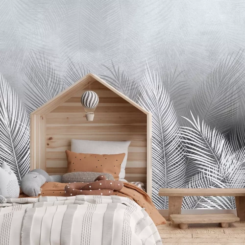 Fotobehang Grijze en witte palmbladeren met een betonnen achtergrondeffect