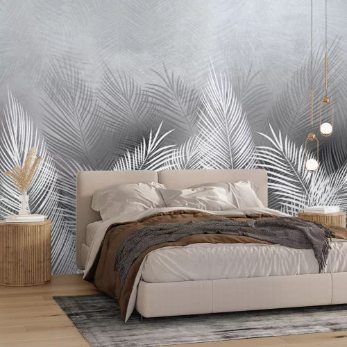 Fotobehang Grijze en witte palmbladeren met een betonnen achtergrondeffect