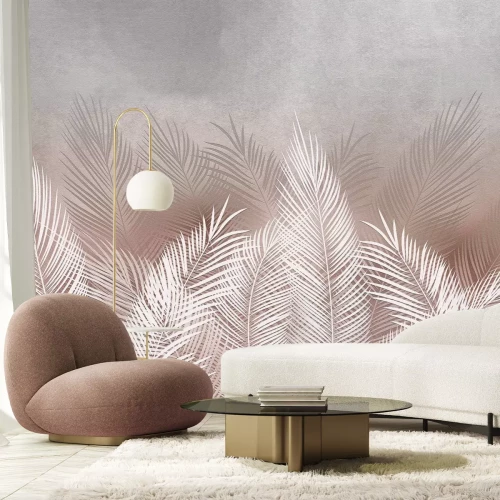 Fotobehang Beige en witte palmbladeren op een betonnen achtergrond