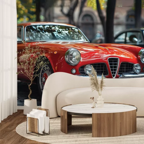 Fotobehang Een rode klassieker in een stedelijke omgeving