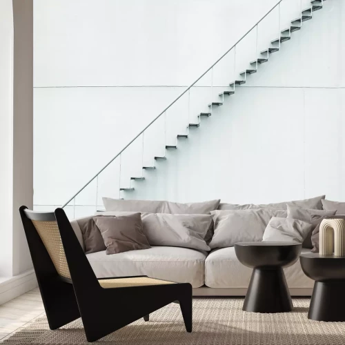 Fotobehang Moderne opengewerkte metalen trap met een witte achtergrond