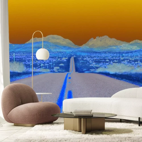 Fotobehang Een rechte betonnen weg die door een uitgestrekte woestijn snijdt