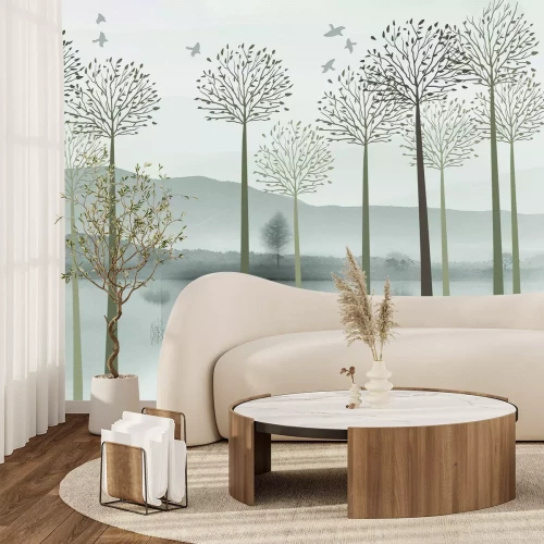 Fotobehang Een schilderachtig landschap met bomen aan de rivieroever