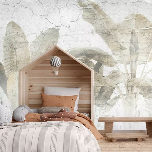 Fotobehang Palmbladeren op een betonnen muur