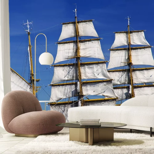 Fotobehang Elegante witte zeilen tegen een heldere hemel