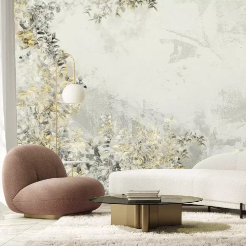 Fotobehang Grijze en gele bladeren op beton