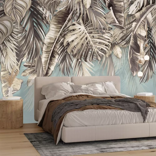 Fotobehang Palm- en monsterabladeren tegen de lucht