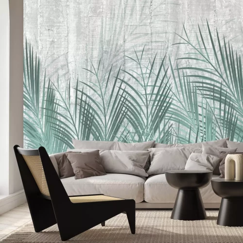 Fotobehang Groene palmbladeren op beton