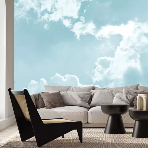 Fotobehang Pluizige wolken tegen de blauwe lucht