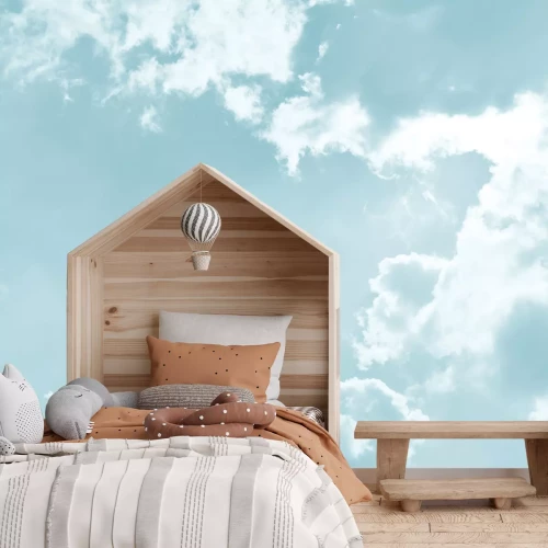 Fotobehang Pluizige wolken tegen de blauwe lucht